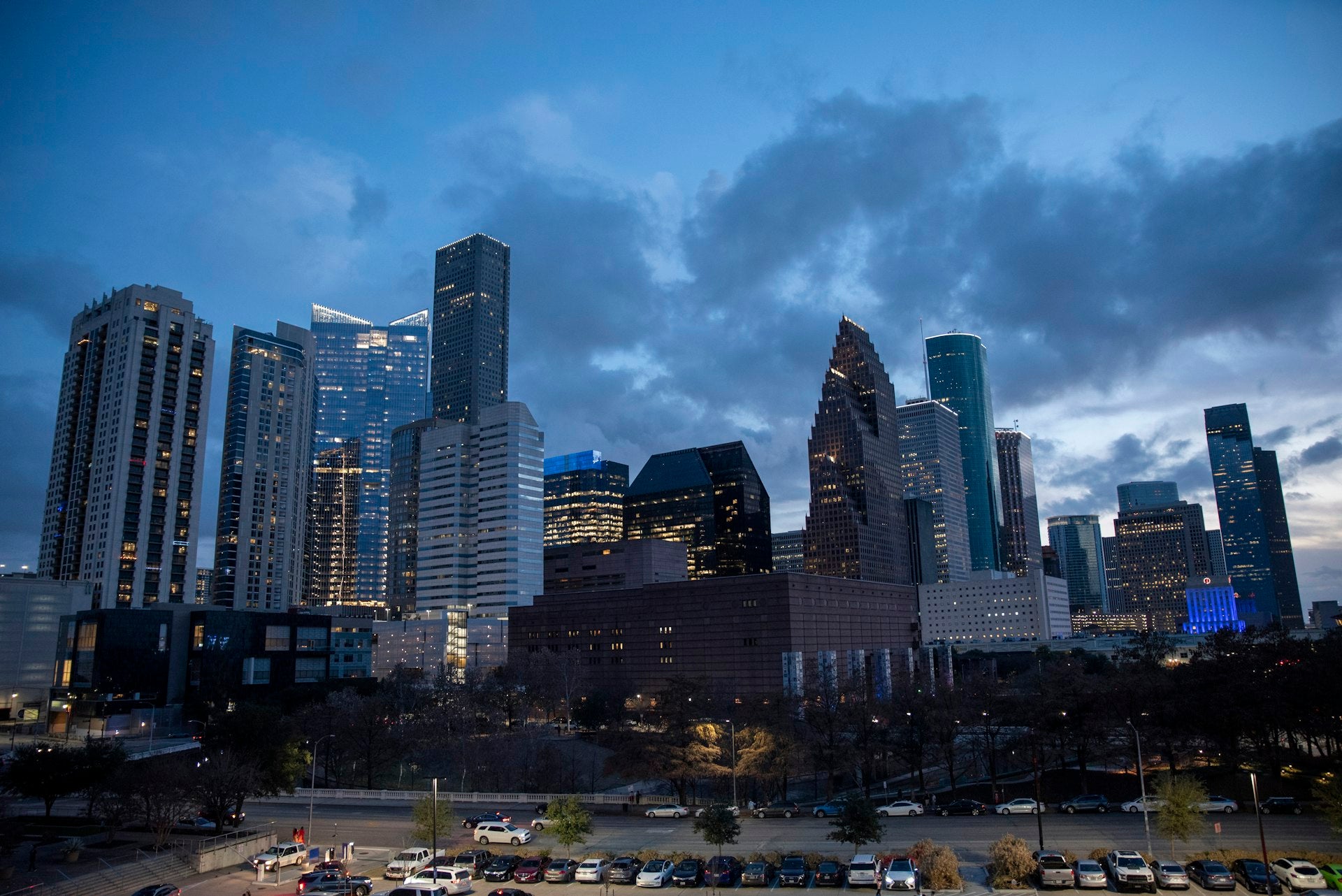 Houston cityscape at dusk with dramatic sky