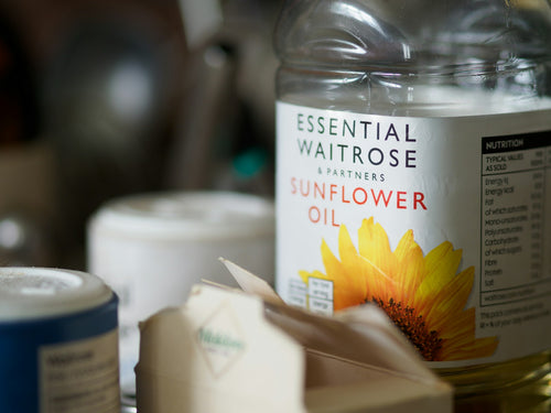 Product bottles and containers on shelf showing ingredient labels to read before buying