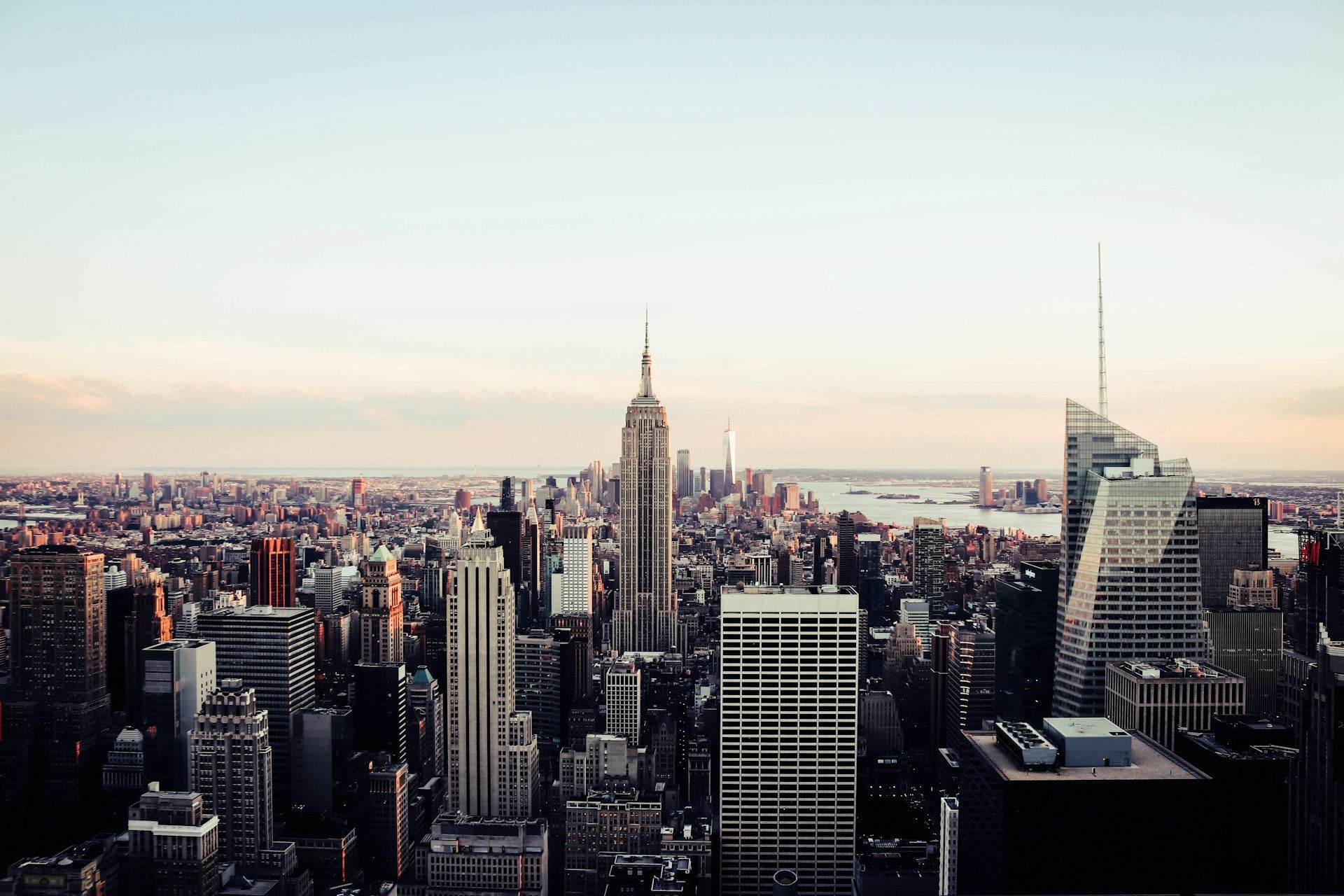 Manhattan skyline at sunset viewed from Brooklyn Bridge